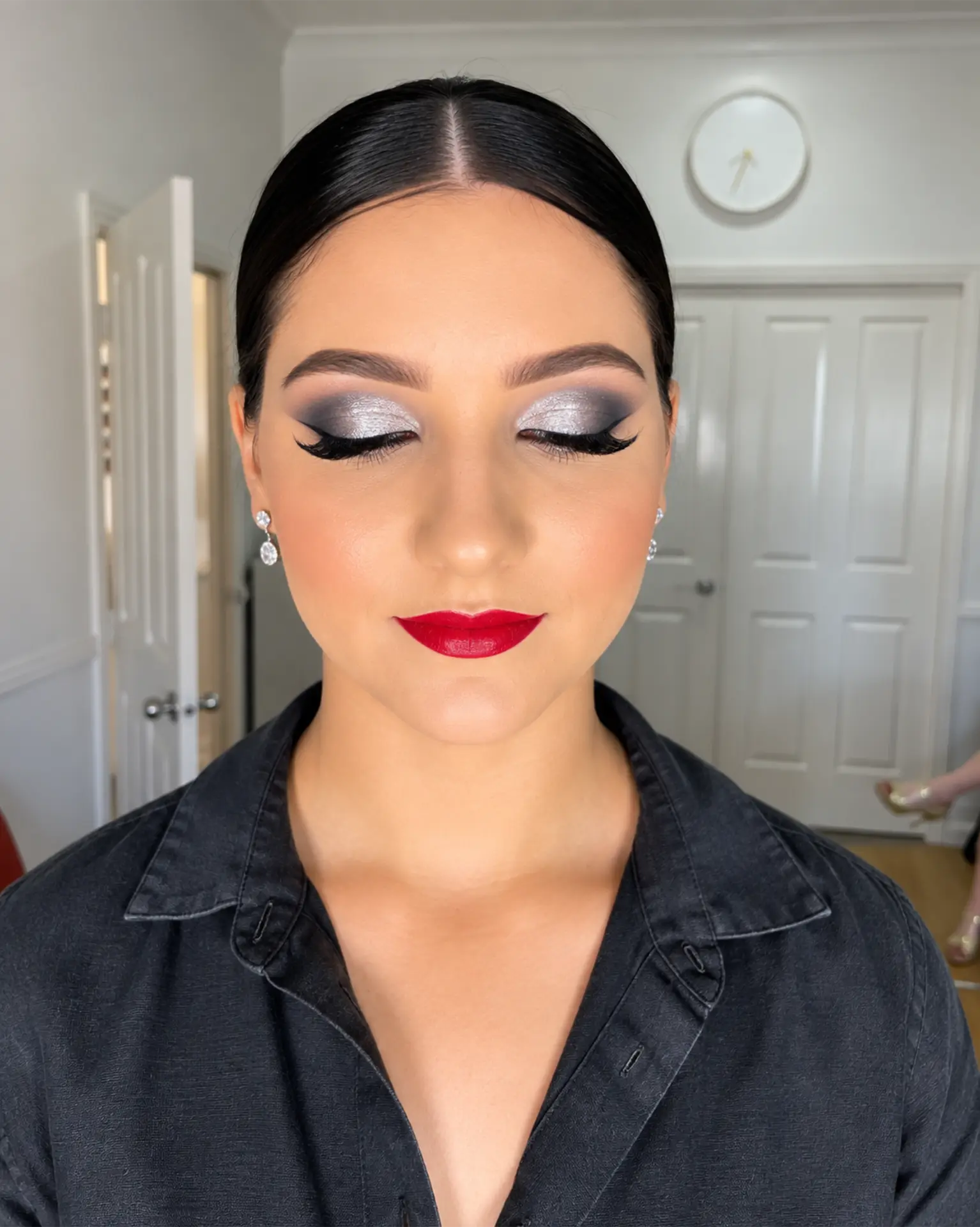 Client with dramatic evening makeup and red lips