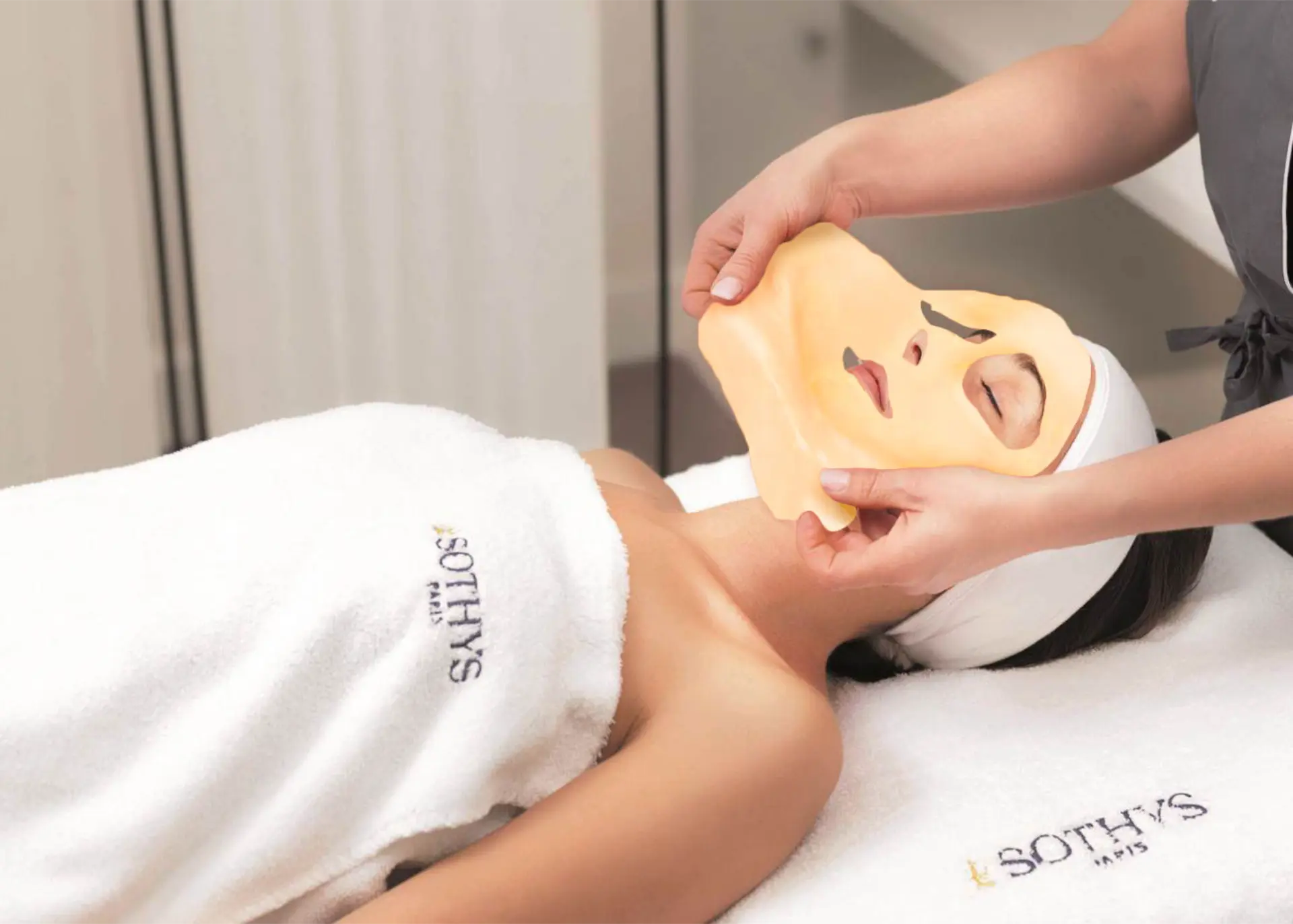 Client having a Sothys facial mask applied