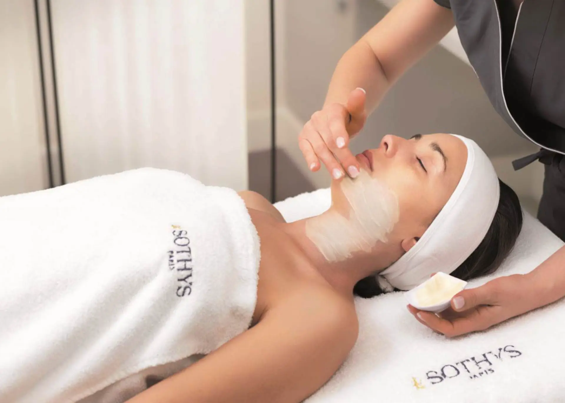 Client relaxing during a facial treatment